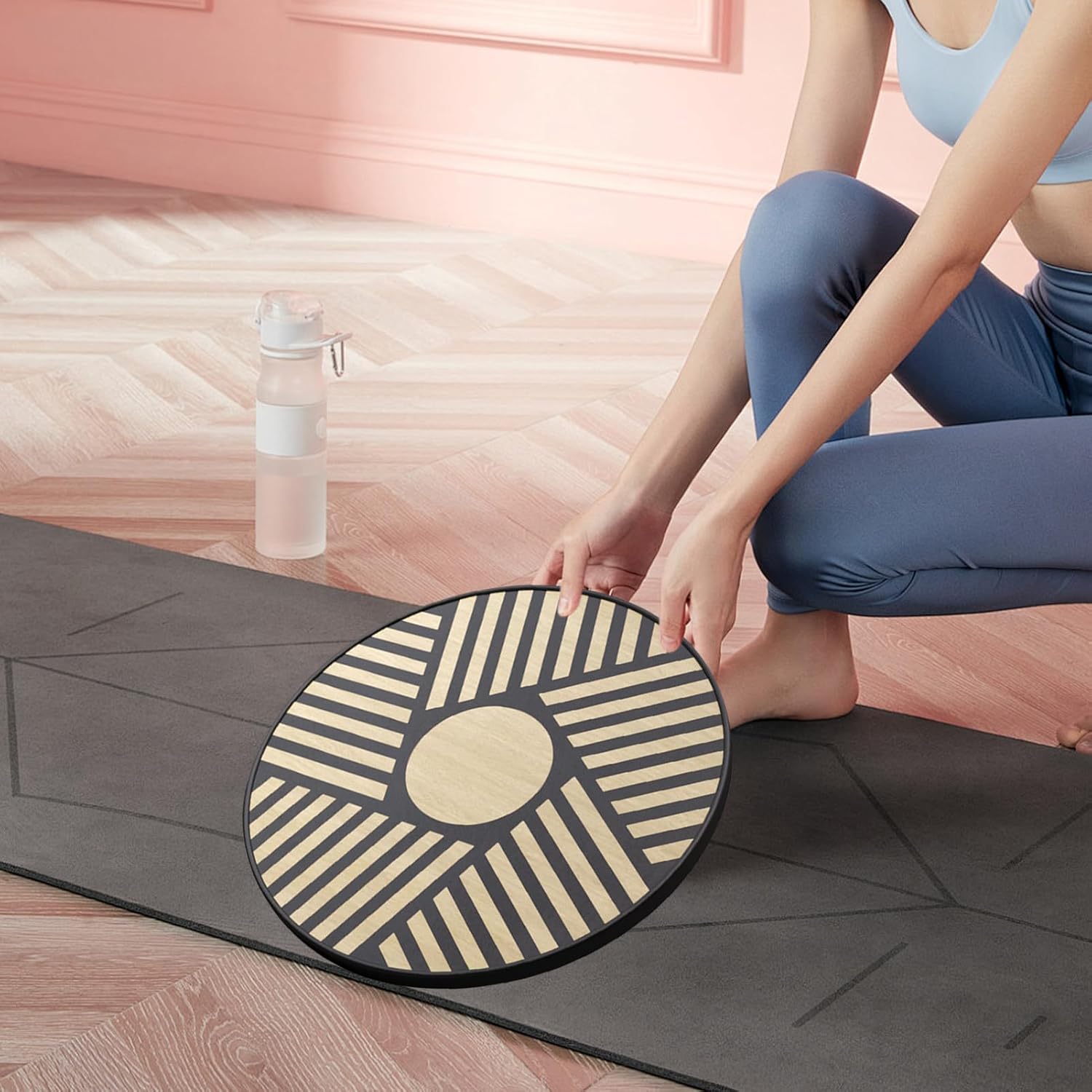 Zentheca Core Balance Trainer on a yoga mat with a person preparing for a workout.