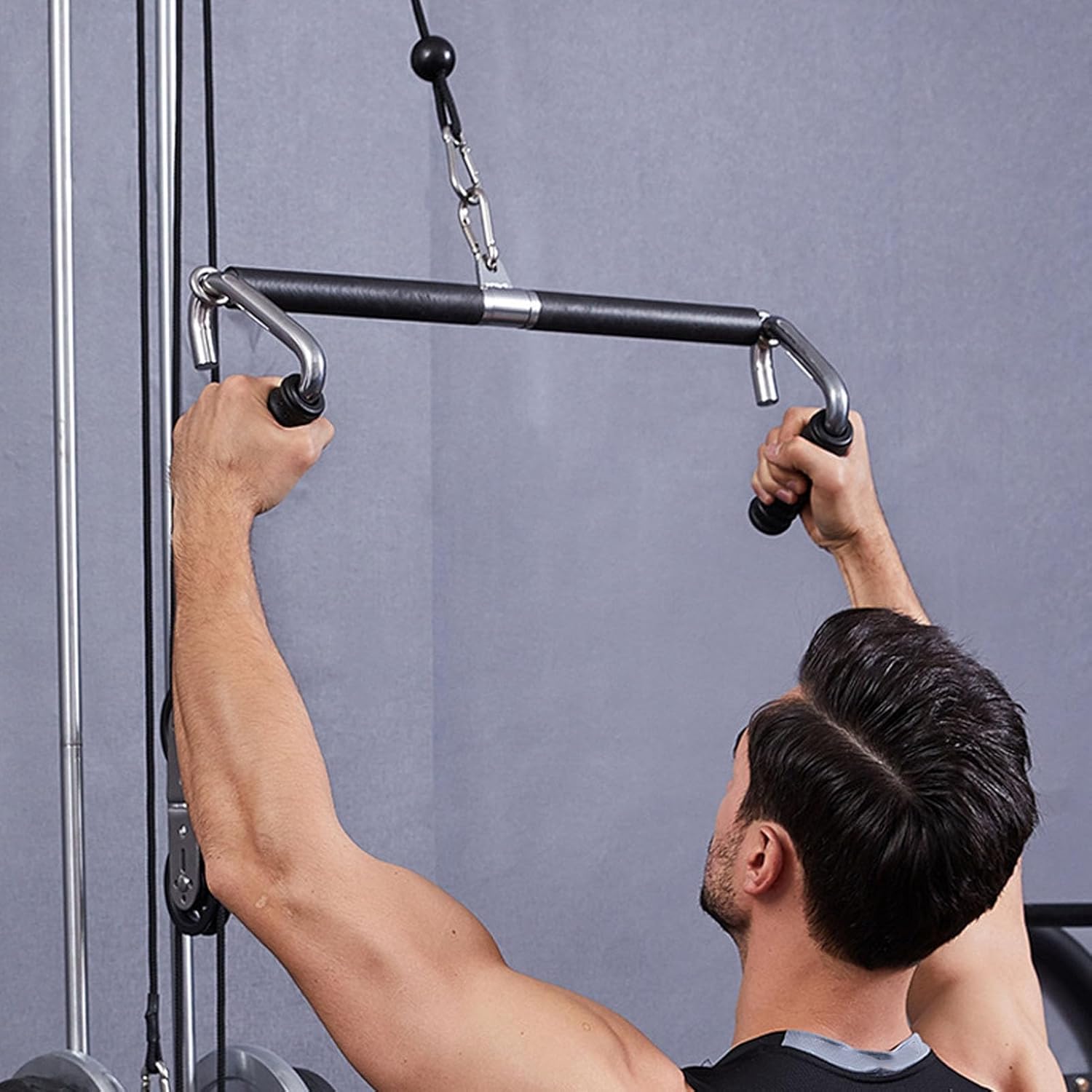 Person using Zentheca FlexCore Handles on a cable machine for strength training.
