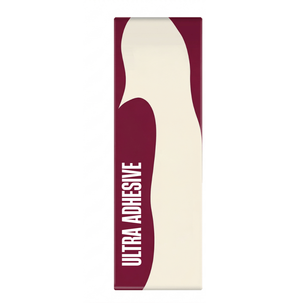 Ultra Adhesive product packaging featuring a smooth design for a flawless beauty routine.