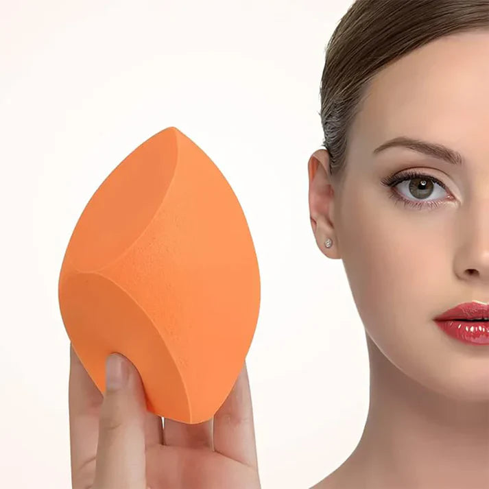 Zentheca – Portable Blender shown with vibrant orange blending sponge for makeup application.