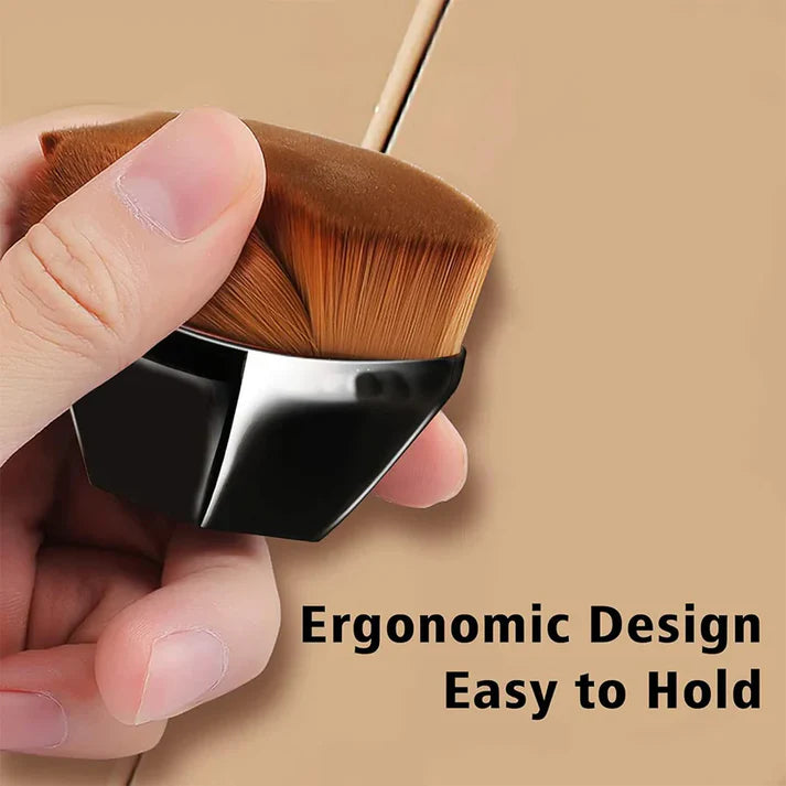 Hand holding a brush with ergonomic design easy to hold for applying makeup.