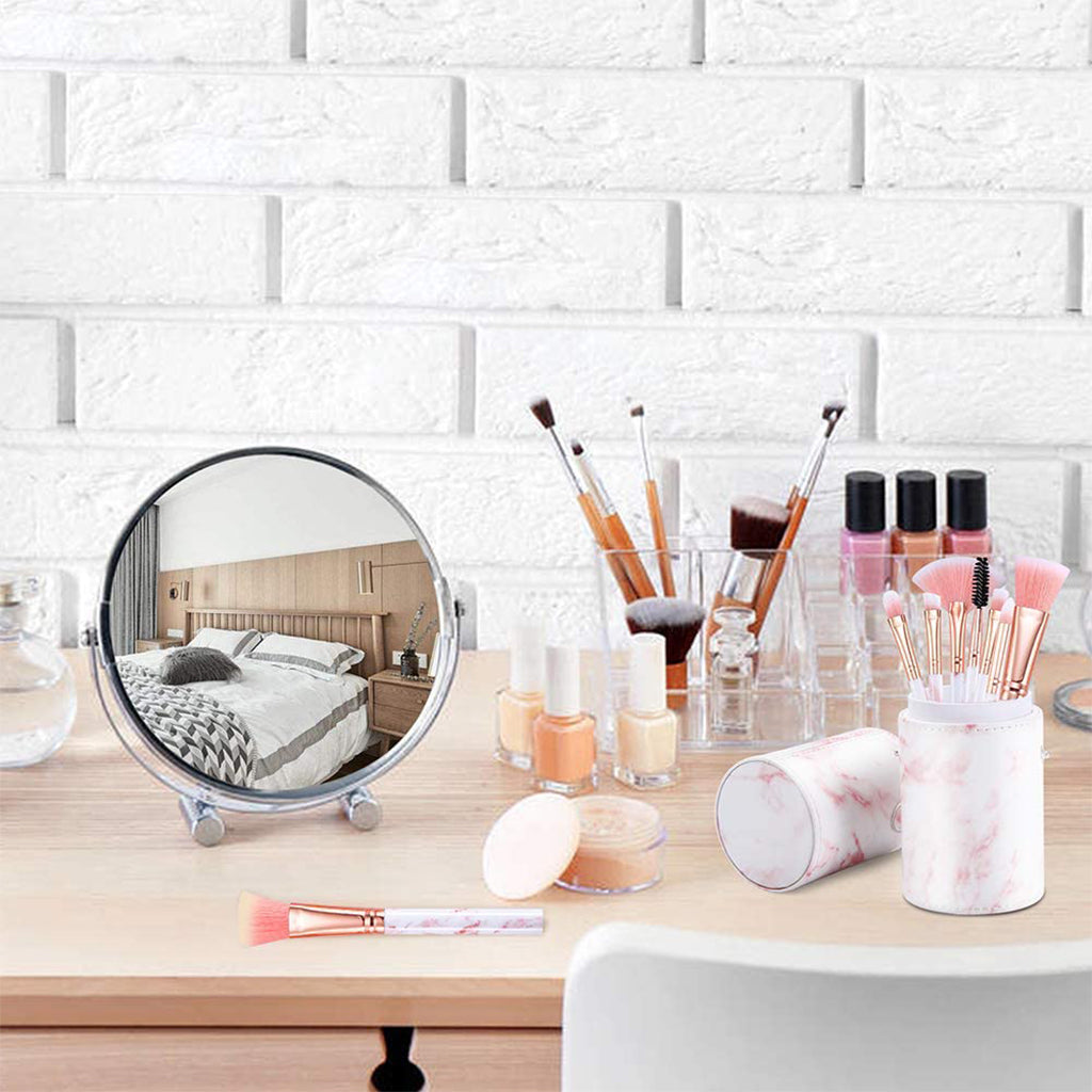 Zentheca – Multi-Use Makeup Brush on a vanity table with a mirror and various makeup products.