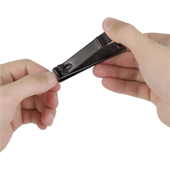 Zentheca – Precision Nail Clipper held in hands demonstrating its ergonomic design and sharp stainless steel blade.