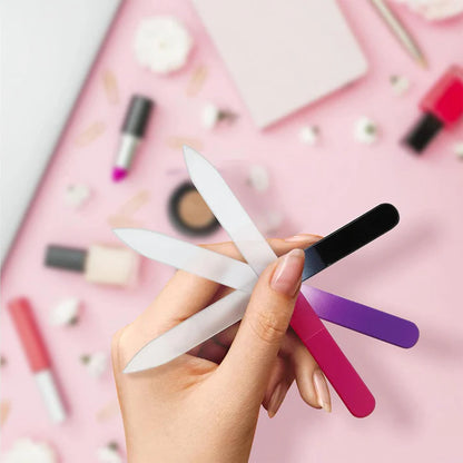 Zentheca – CrystalFile Nail File in hand, showcasing various colors and a polished nail care setup.
